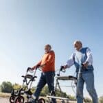 Senior Men Walking with all terrain rollator walkers