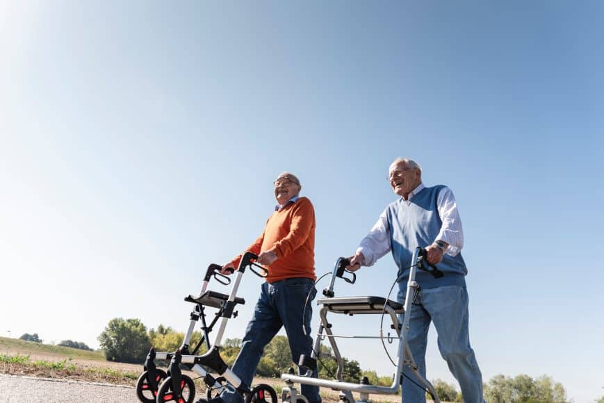 Senior Men Walking with all terrain rollator walkers